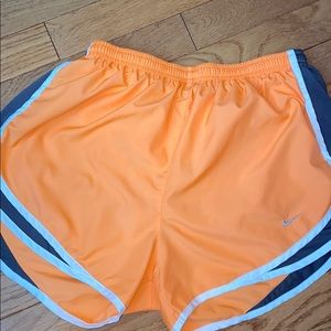 Orange Nike Dri-fit running shorts